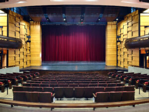 Auditorium stage with decorative paneled walls
